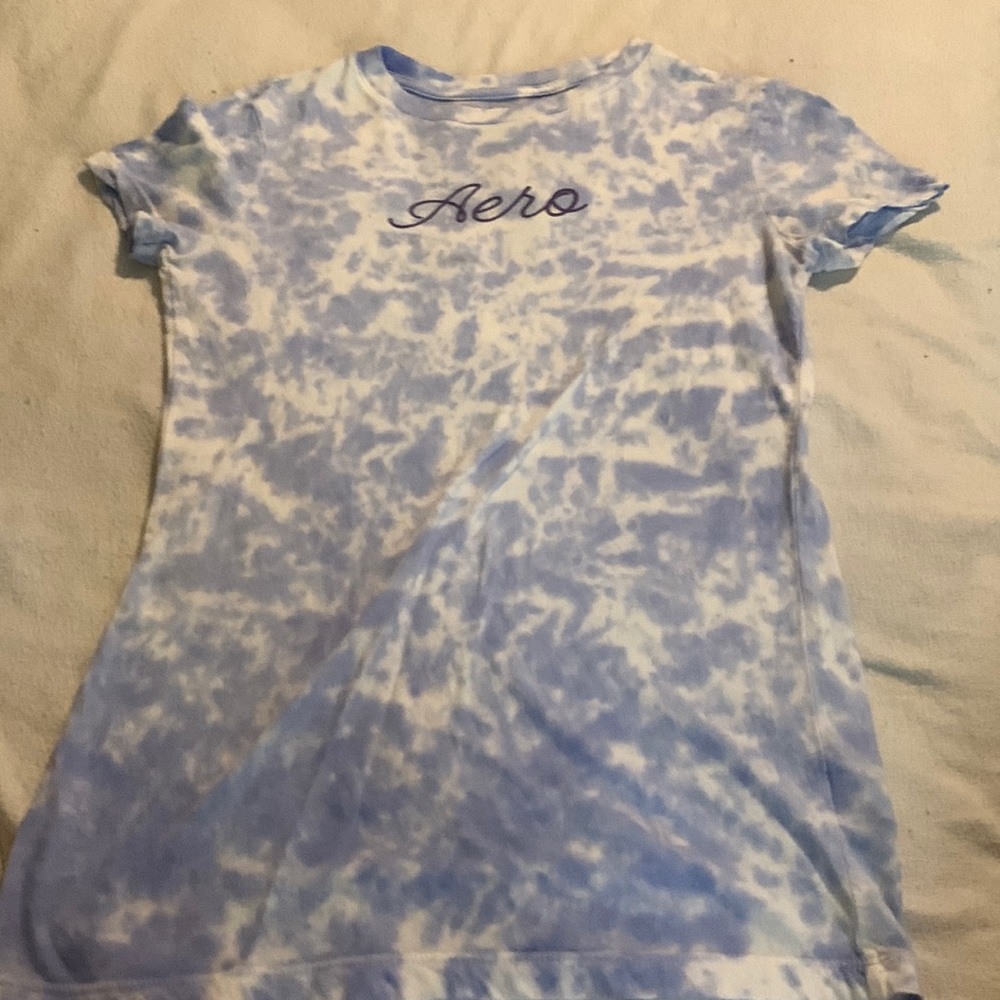 light blue cloudy shirt with lettering